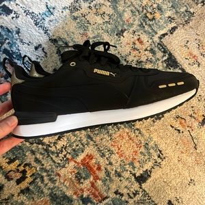 Size 10.5 (US) Puma SoftFoam shoes in black and gold
